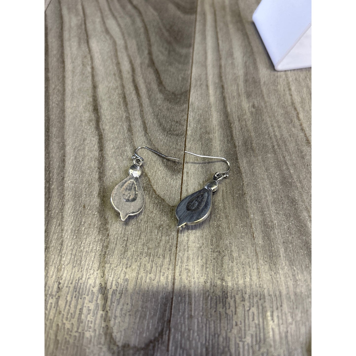 Purple stones on silver tear drop earrings