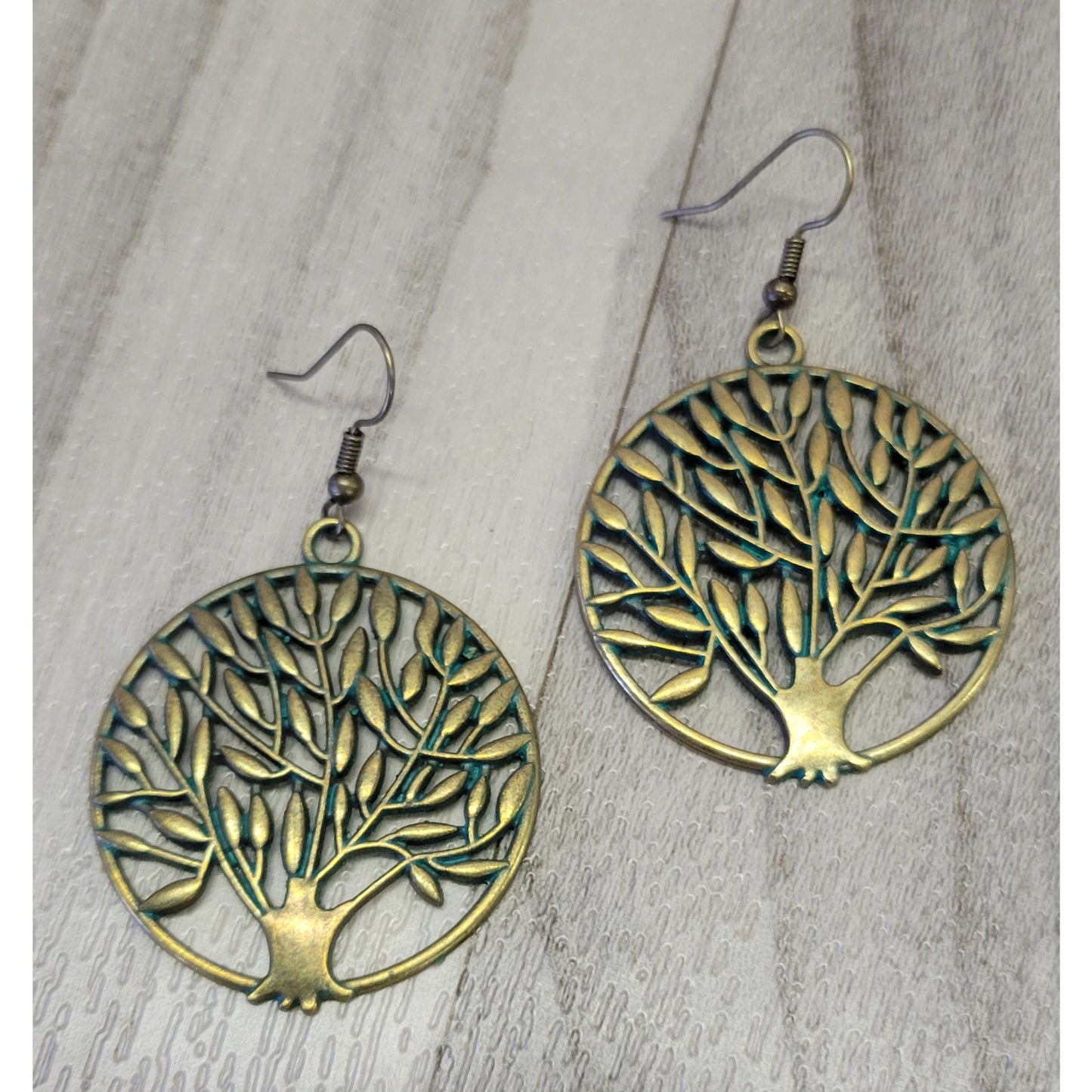 Gold tone tree of life earrings